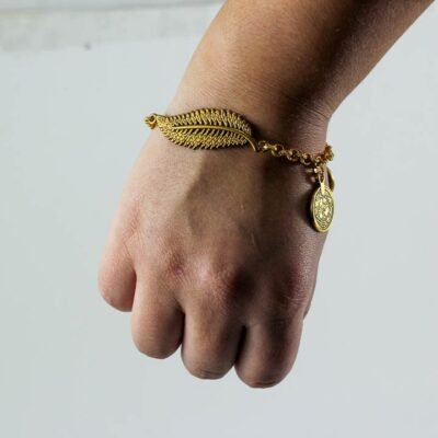 Bracelet, Golden colored coins and a leaf